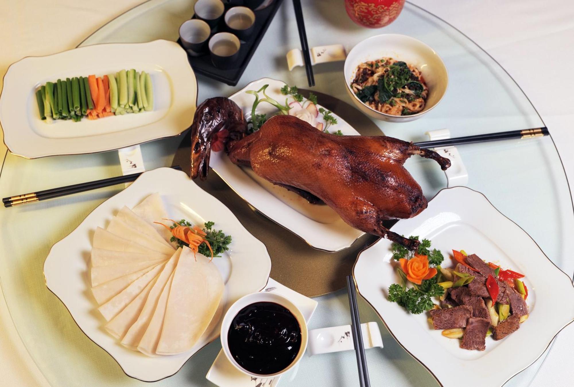 Beijing Palace Soluxe Hotel Astana Exteriér fotografie A selection of dishes prepared with duck